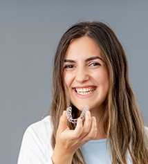 Closeup of clear aligner on grey surface